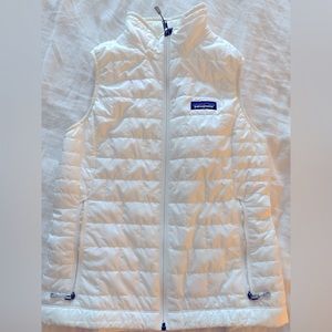 Like new Patagonia Vest. Worn once. Bright white, thin and so warm!